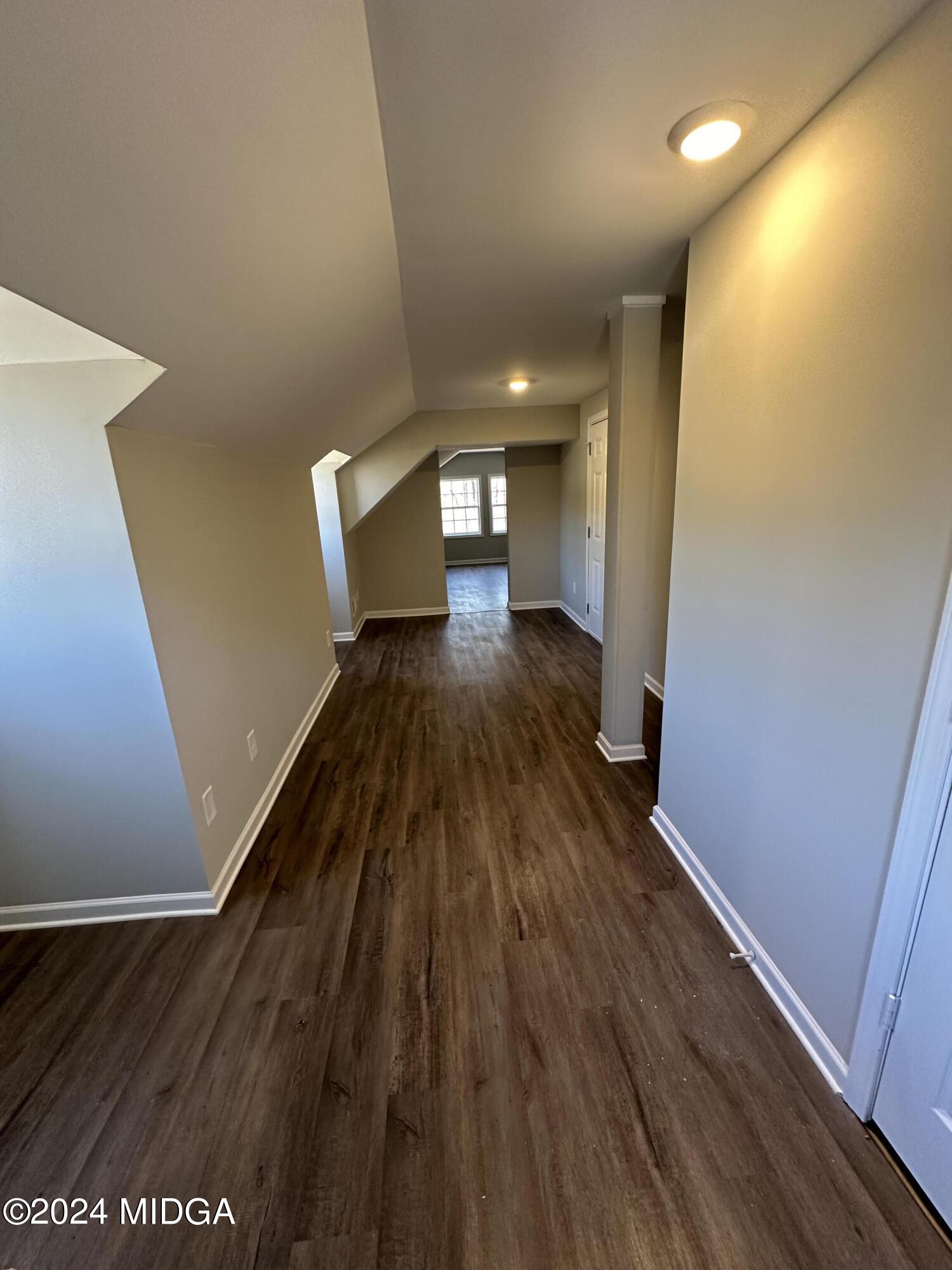 365 Taylor Road Juliette, GA 31046 - Photo 10 of 12 a view of a hallway with wooden floor
