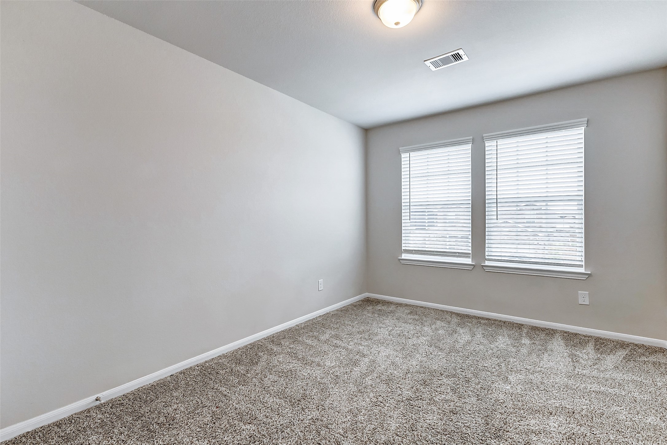 10511 Snowy Ridge Lane Rosharon, TX 77583 - Photo 24 of 32 an empty room with a empty space and windows