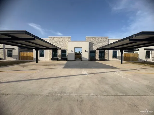 a view of a house with more windows and a ceiling tree