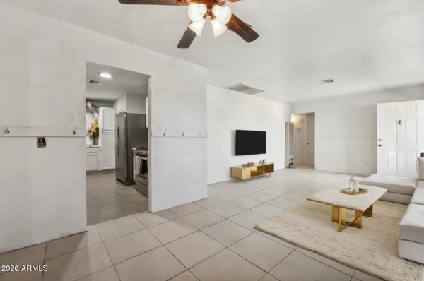 a living room with furniture and a flat screen tv