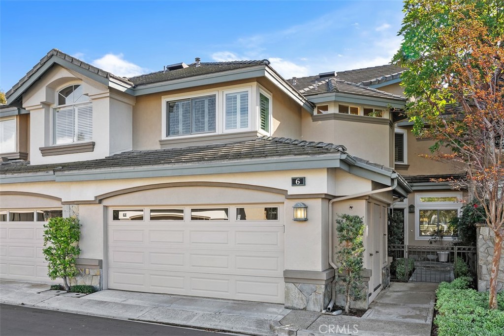 6 Stoney Pointe Laguna Niguel, CA 92677 - Photo 1 of 37 a front view of a house with a tree