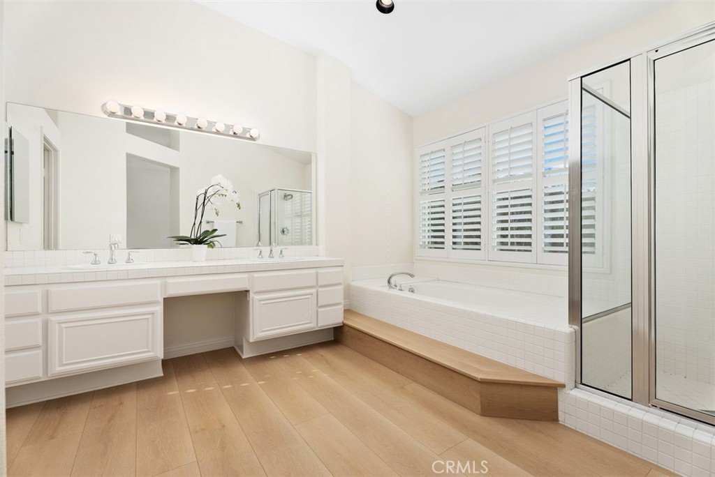 6 Stoney Pointe Laguna Niguel, CA 92677 - Photo 23 of 37 a bathroom with a bathtub sink and mirror