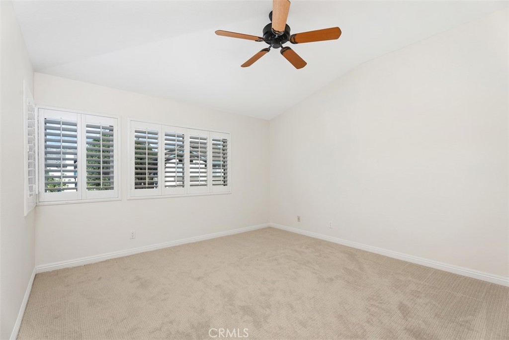 6 Stoney Pointe Laguna Niguel, CA 92677 - Photo 25 of 37 an empty room with a window and a ceiling fan