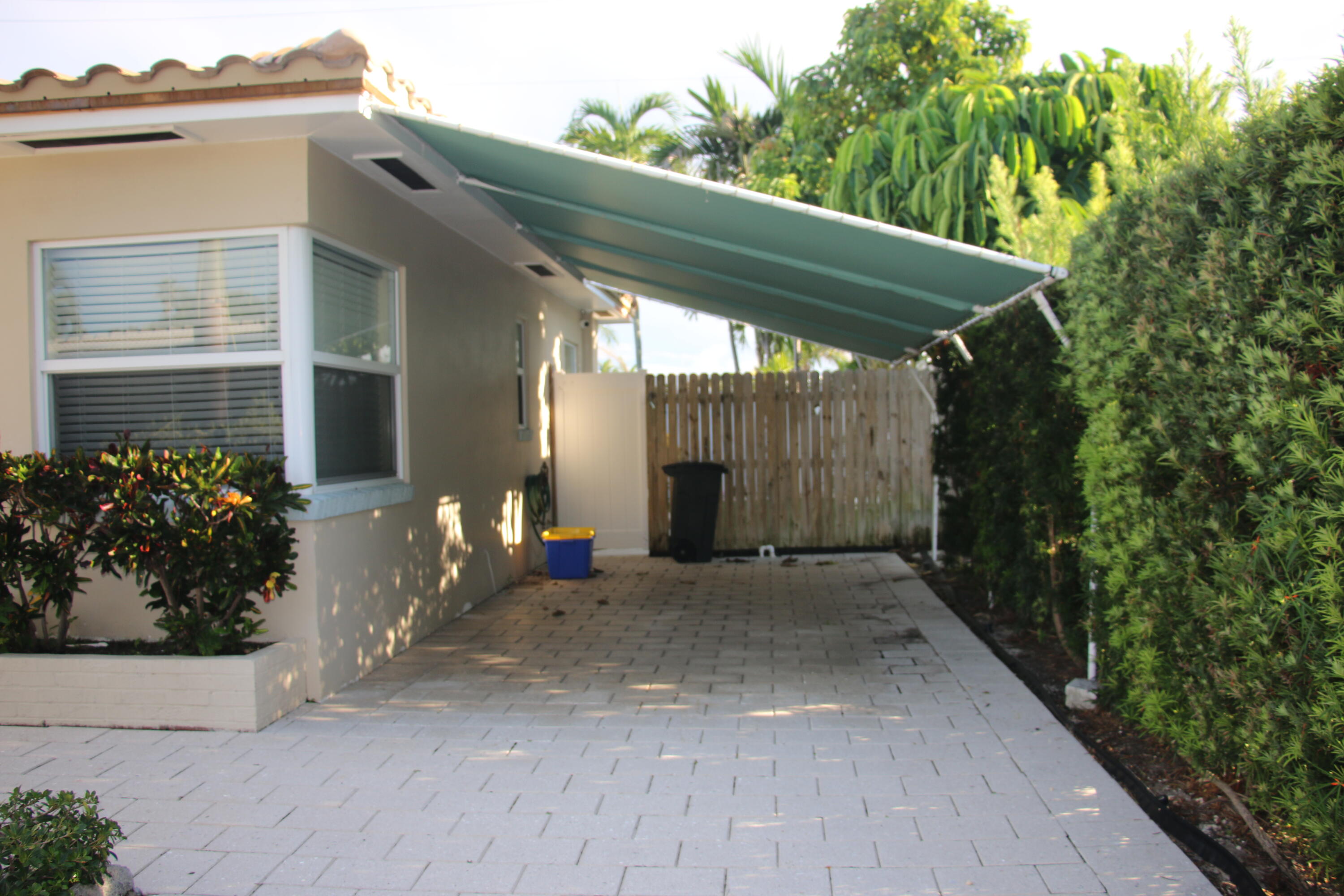 42 Douglas Drive Ocean Ridge, FL 33435 - Photo 5 of 8 a view of a house with potted plants