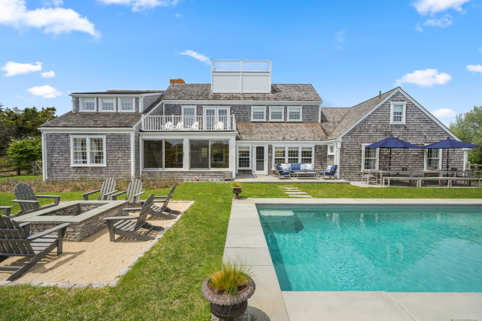21 Quidnet Road Nantucket, MA 02554 - Photo 5 of 62 a view of house with a swimming pool