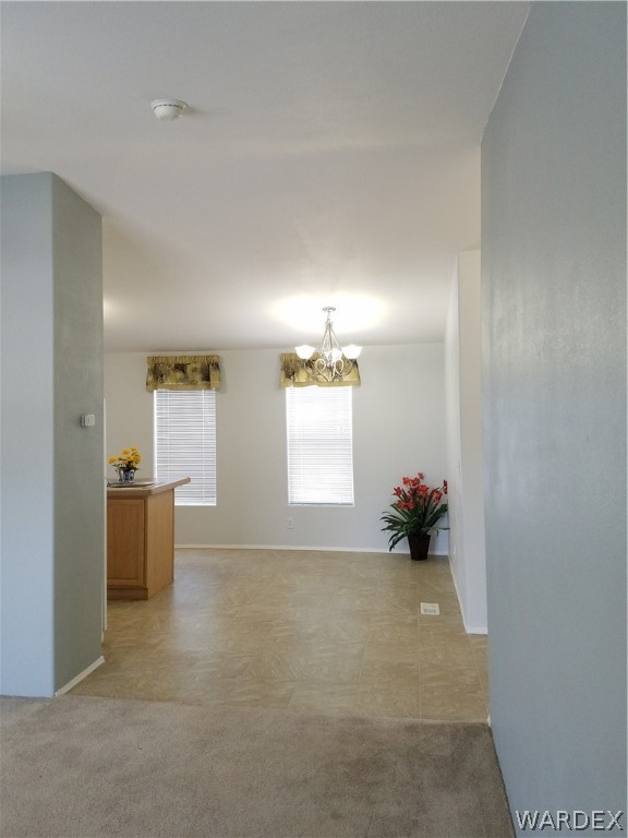 3955 Bosque Road Golden Valley, AZ 86413 - Photo 6 of 27 an empty room with windows and furniture
