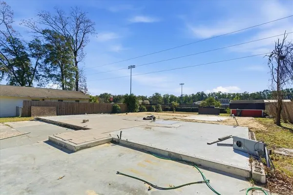a view of a yard with swimming pool