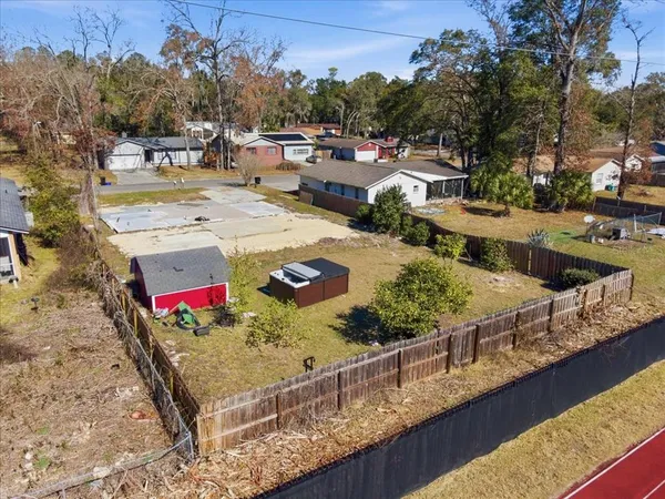 a view of a backyard with sitting area