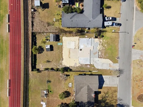 an aerial view of residential houses with outdoor space