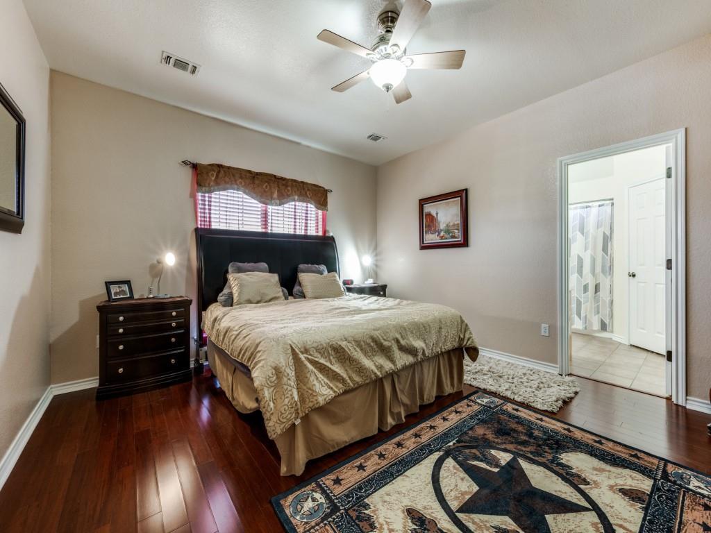 100 County Road 4181 Decatur, TX 76234 - Photo 15 of 35 a bedroom with a bed and wooden floor