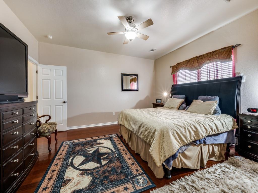 100 County Road 4181 Decatur, TX 76234 - Photo 16 of 35 a bedroom with a bed and a flat screen tv