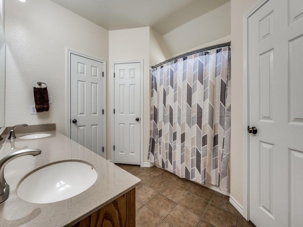 100 County Road 4181 Decatur, TX 76234 - Photo 18 of 35 a bathroom with a sink and a mirror