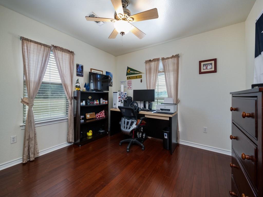 100 County Road 4181 Decatur, TX 76234 - Photo 20 of 35 a view of a workspace with furniture and a window
