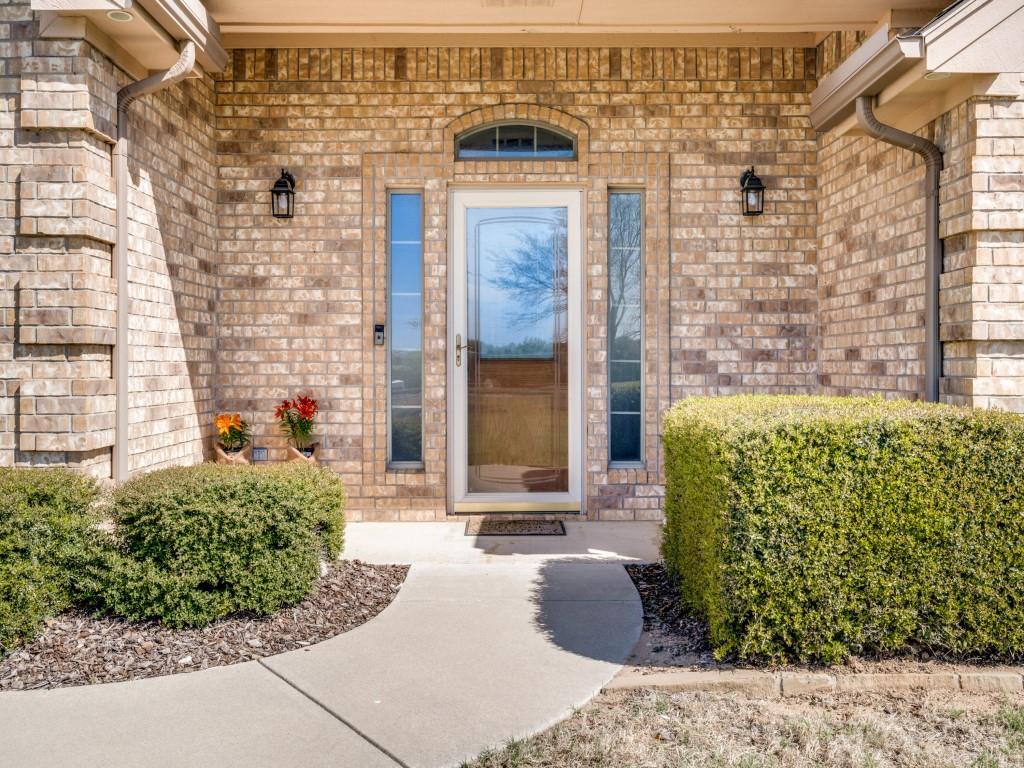 100 County Road 4181 Decatur, TX 76234 - Photo 2 of 35 a front view of a house with a garden