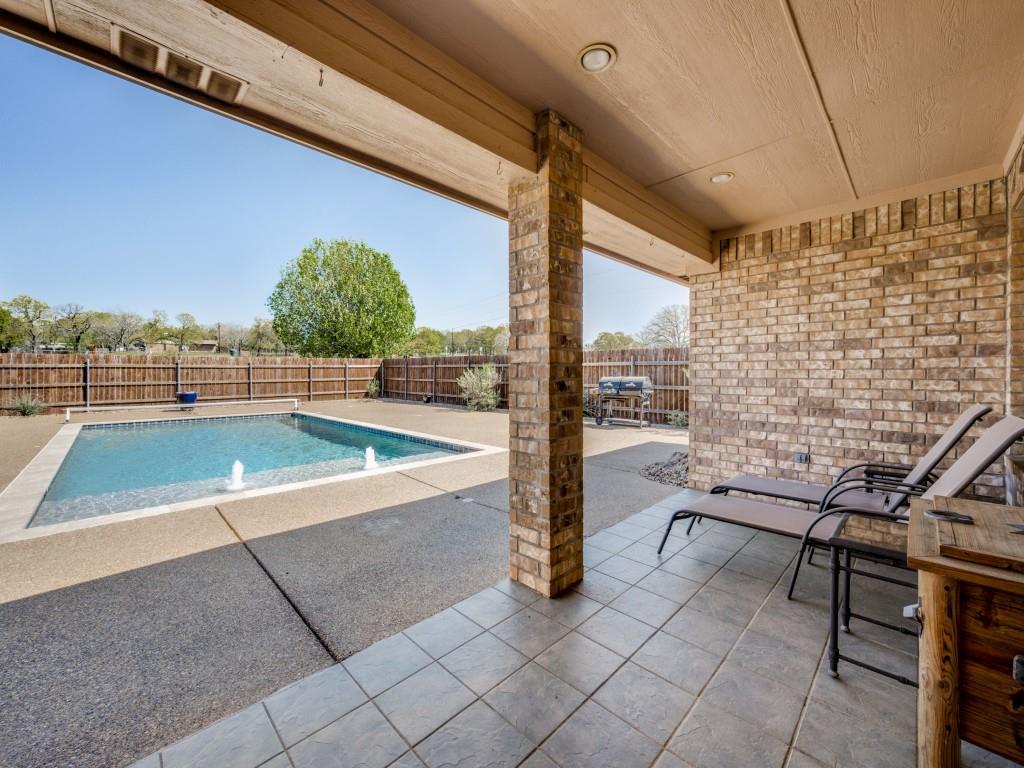 100 County Road 4181 Decatur, TX 76234 - Photo 24 of 35 a view of a patio with a table and chairs