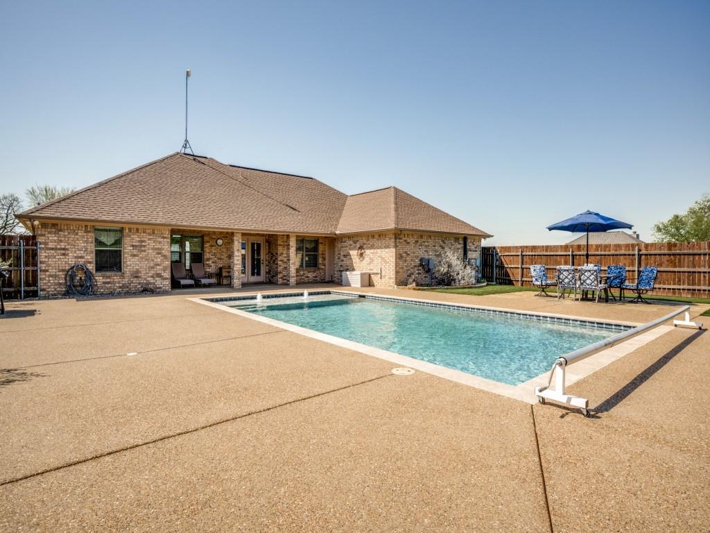 100 County Road 4181 Decatur, TX 76234 - Photo 25 of 35 a house with lots of trees in the background