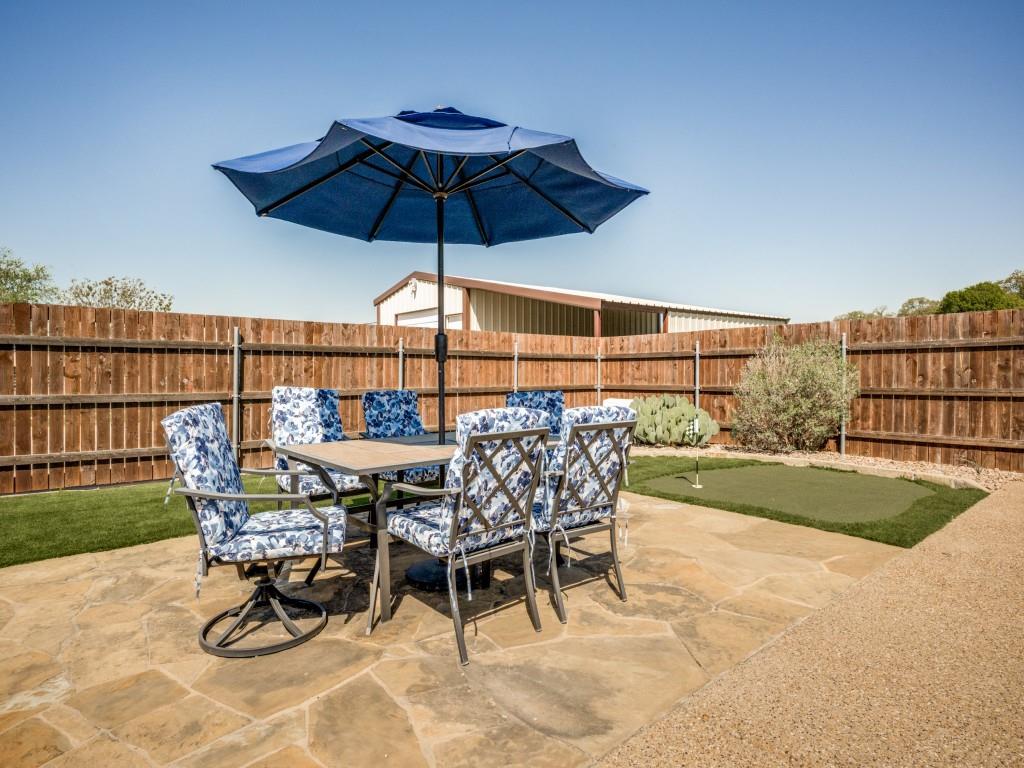 100 County Road 4181 Decatur, TX 76234 - Photo 29 of 35 a view of a terrace with furniture and umbrella
