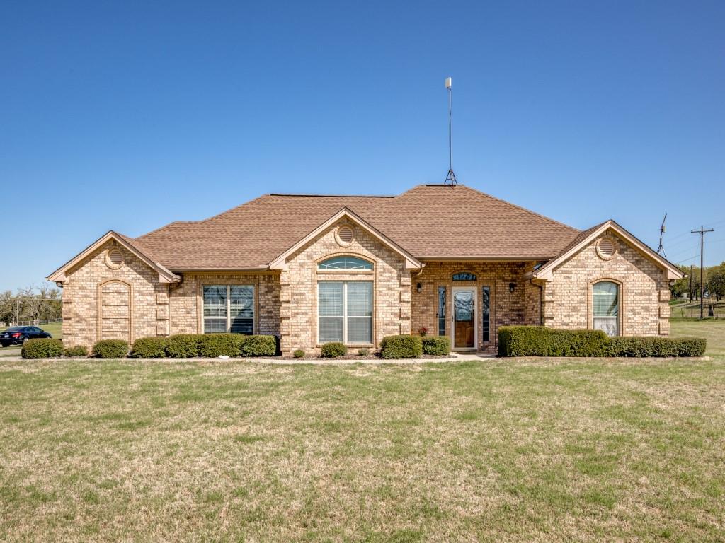 100 County Road 4181 Decatur, TX 76234 - Photo 3 of 35 a front view of a house with a yard