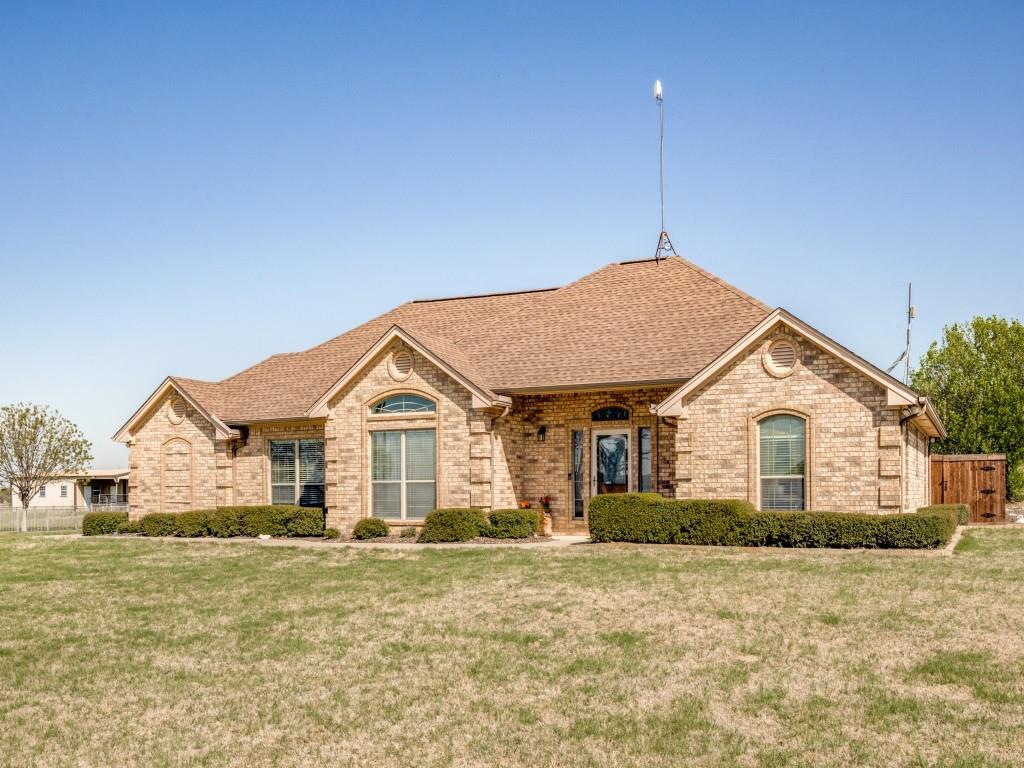 100 County Road 4181 Decatur, TX 76234 - Photo 4 of 35 a view of a house next to a big yard