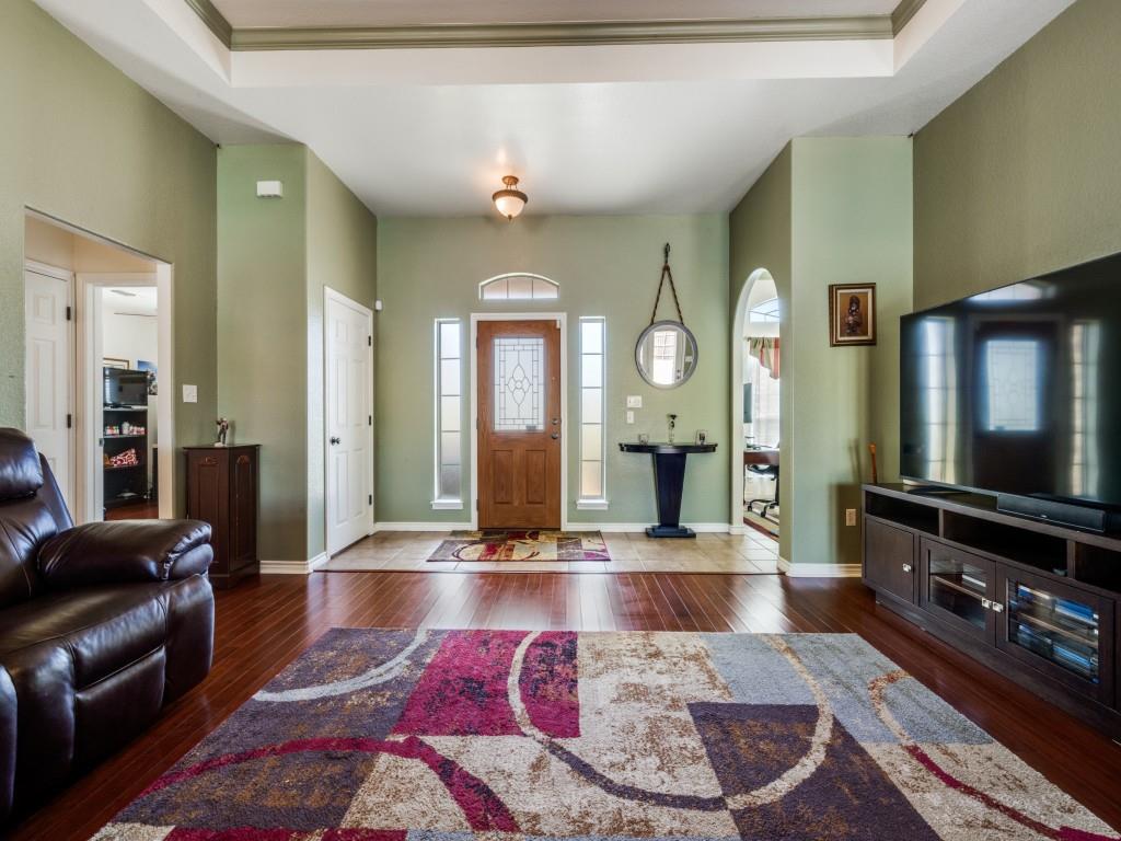 100 County Road 4181 Decatur, TX 76234 - Photo 5 of 35 a living room with furniture and a flat screen tv
