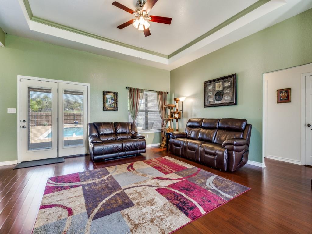 100 County Road 4181 Decatur, TX 76234 - Photo 6 of 35 a living room with furniture and a wooden floor