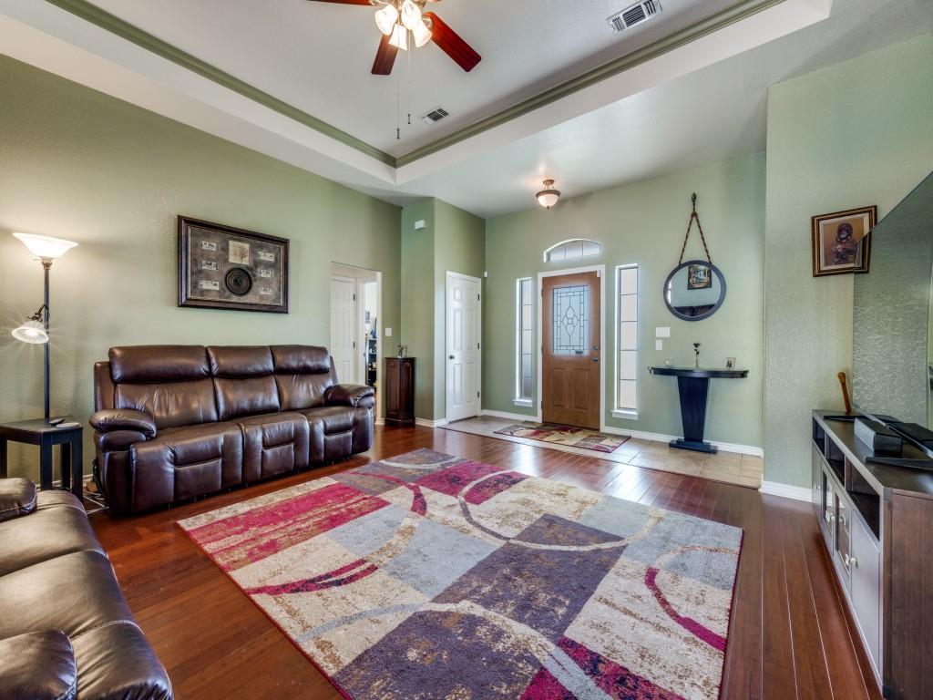 100 County Road 4181 Decatur, TX 76234 - Photo 7 of 35 a living room with furniture and a wooden floor