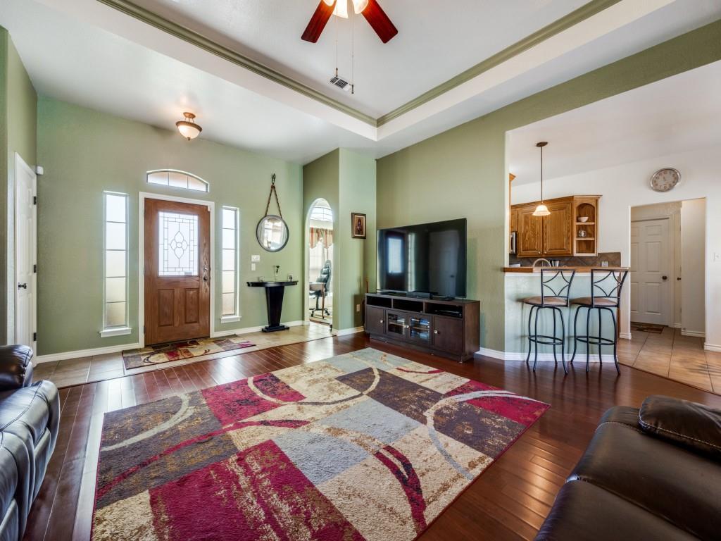 100 County Road 4181 Decatur, TX 76234 - Photo 8 of 35 a living room with furniture a flat screen tv and a table