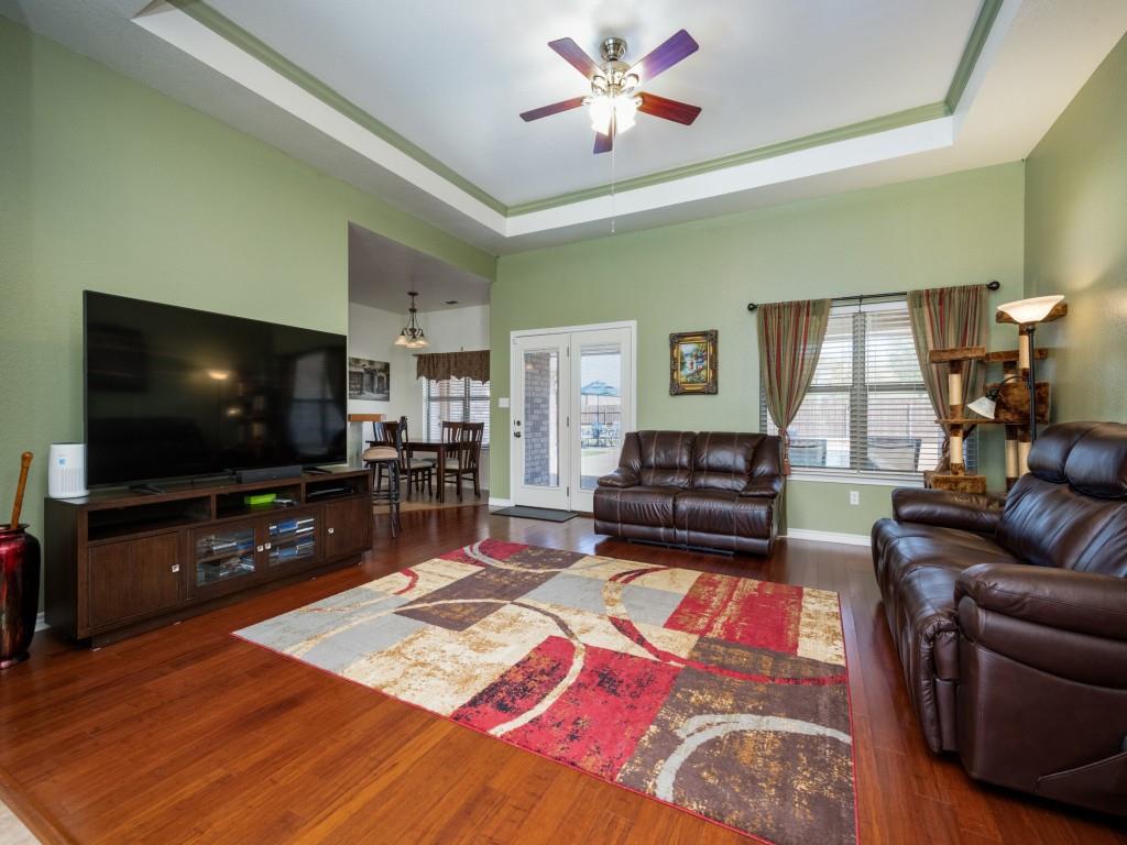 100 County Road 4181 Decatur, TX 76234 - Photo 9 of 35 a living room with furniture and a flat screen tv