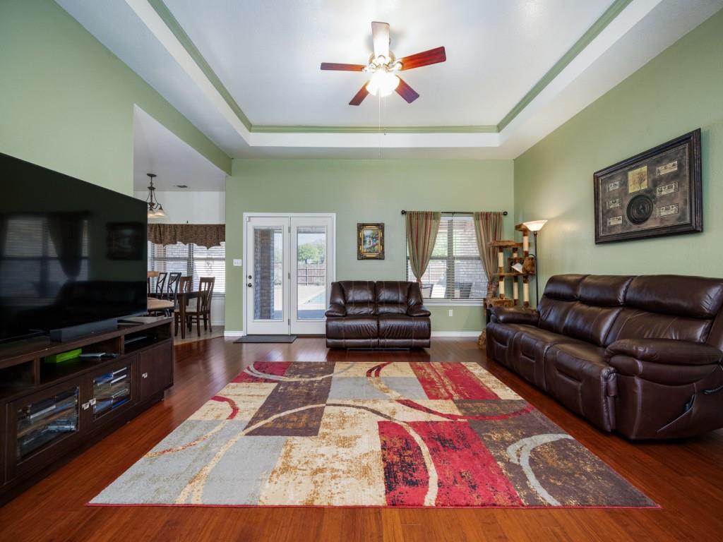 100 County Road 4181 Decatur, TX 76234 - Photo 10 of 35 a living room with furniture and a flat screen tv