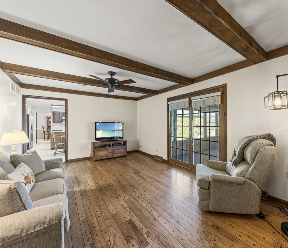 1580 Clemson Drive Naperville, IL 60565 - Photo 19 of 34 a living room with furniture and a wooden floor