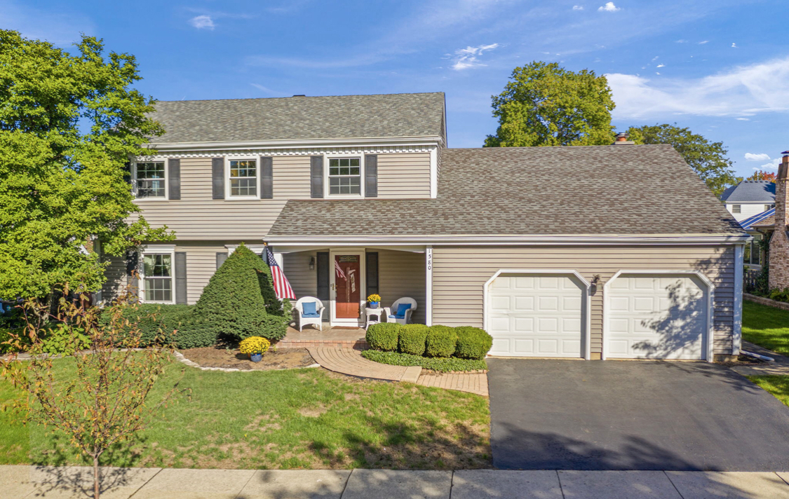 1580 Clemson Drive Naperville, IL 60565 - Photo 2 of 34 a front view of a house with garden