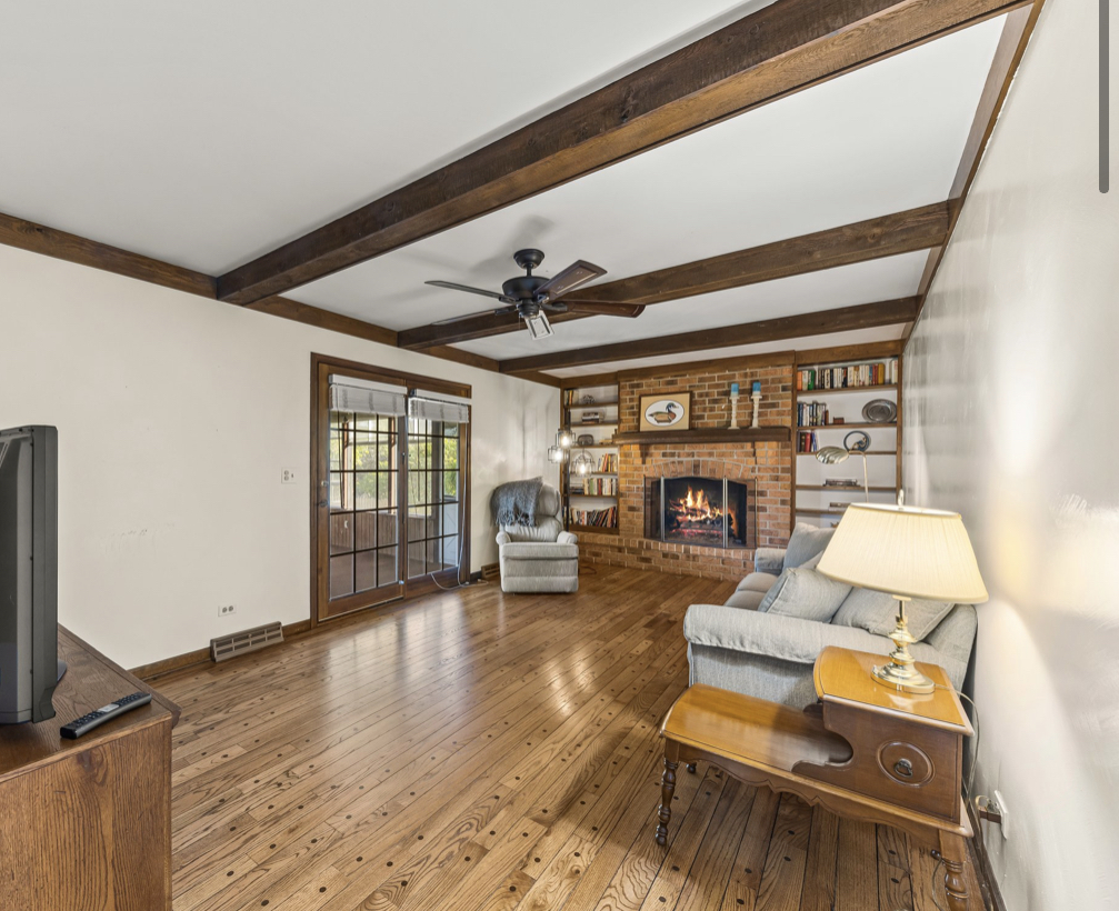 1580 Clemson Drive Naperville, IL 60565 - Photo 21 of 34 a living room with furniture and a wooden floor