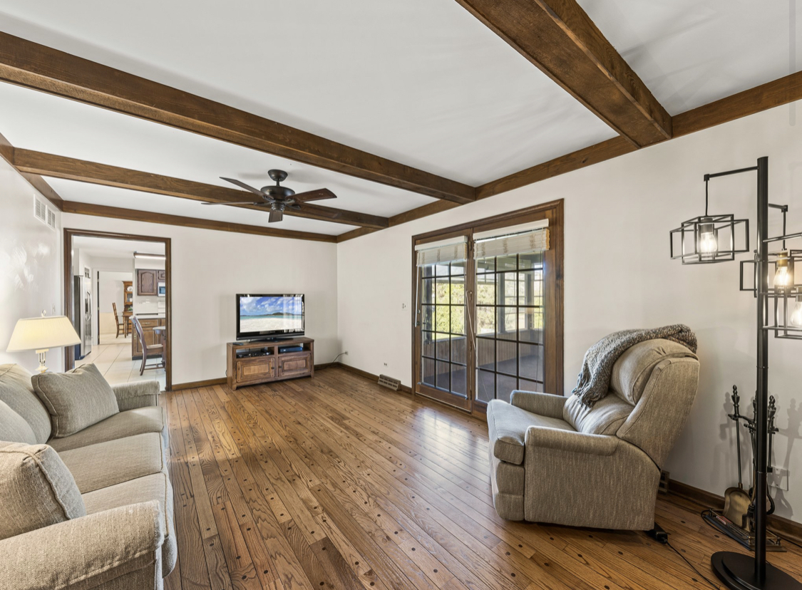 1580 Clemson Drive Naperville, IL 60565 - Photo 22 of 34 a living room with furniture and a fireplace