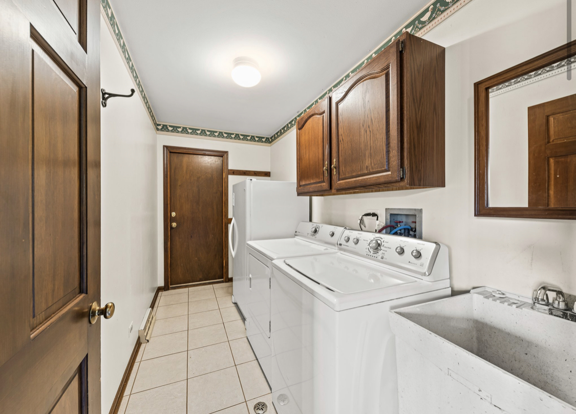 1580 Clemson Drive Naperville, IL 60565 - Photo 23 of 34 a living room with furniture and a flat screen tv