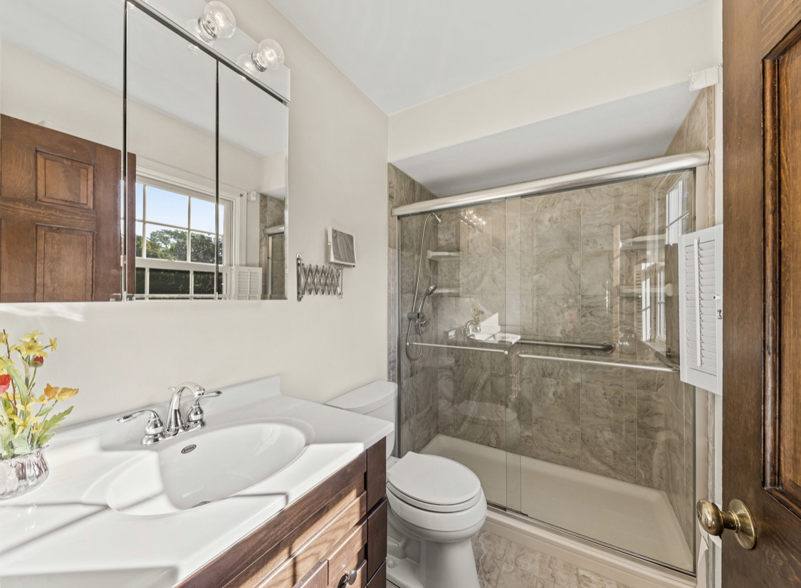 1580 Clemson Drive Naperville, IL 60565 - Photo 27 of 34 a bathroom with a toilet sink and shower