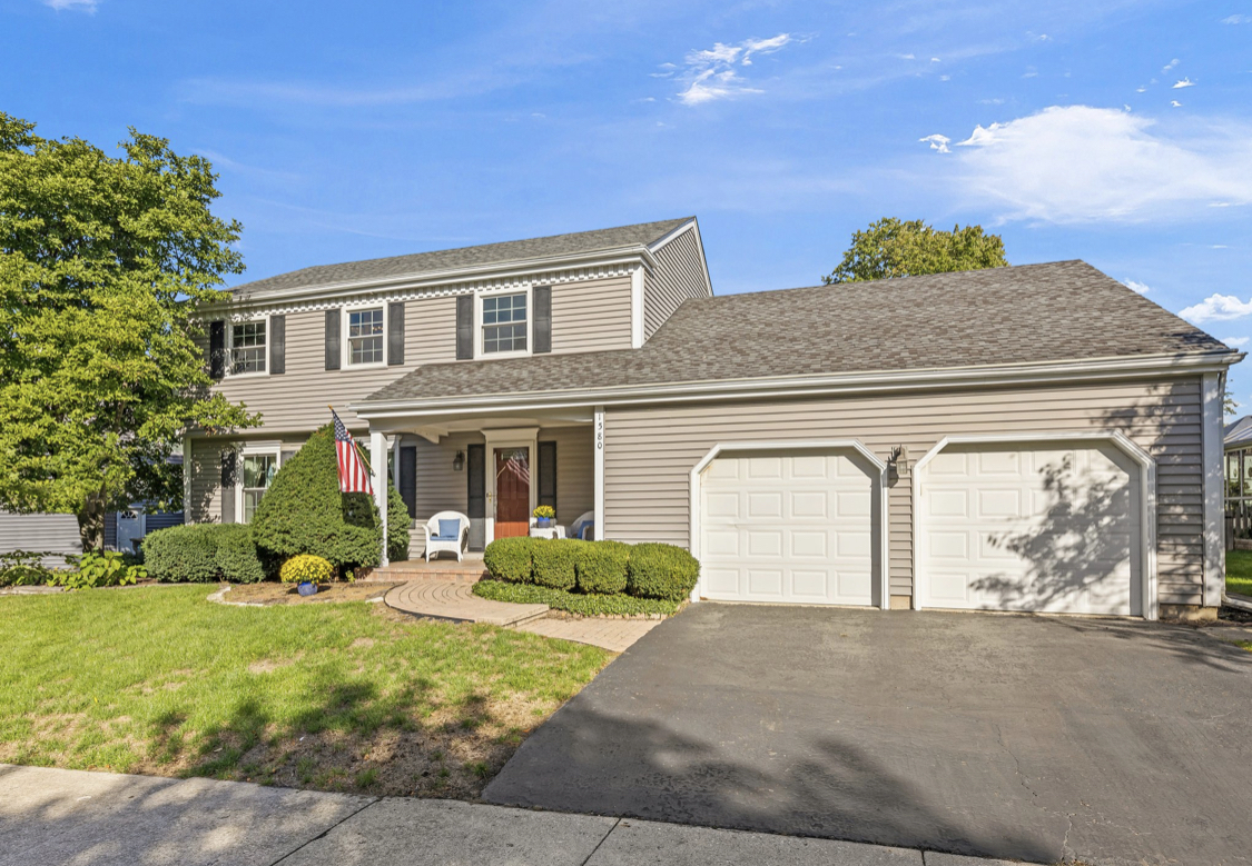 1580 Clemson Drive Naperville, IL 60565 - Photo 3 of 34 a front view of a house with a yard and garage