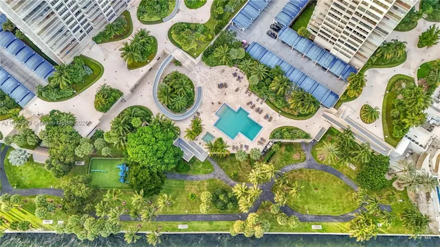 an aerial view of a house with a yard and plants