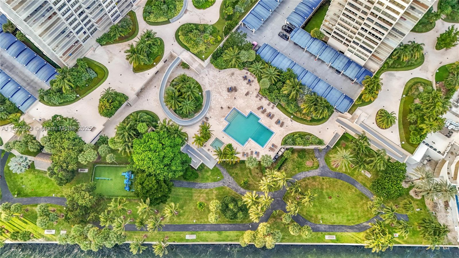 3 Grove Isle Drive, Unit C708 Miami, FL 33133 - Photo 13 of 16 an aerial view of a house with a yard and plants