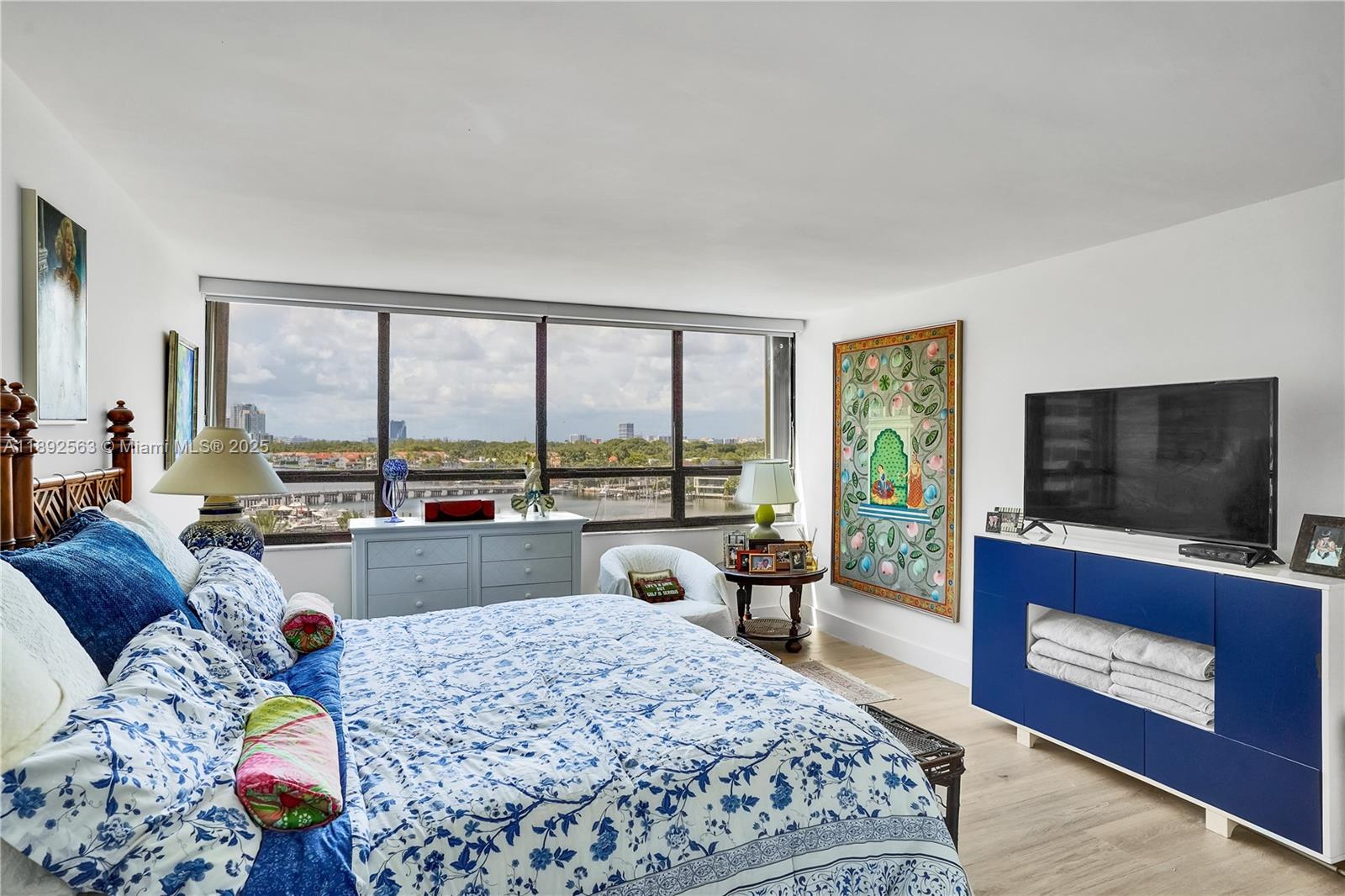 3 Grove Isle Drive, Unit C708 Miami, FL 33133 - Photo 7 of 16 a living room with furniture and a flat screen tv