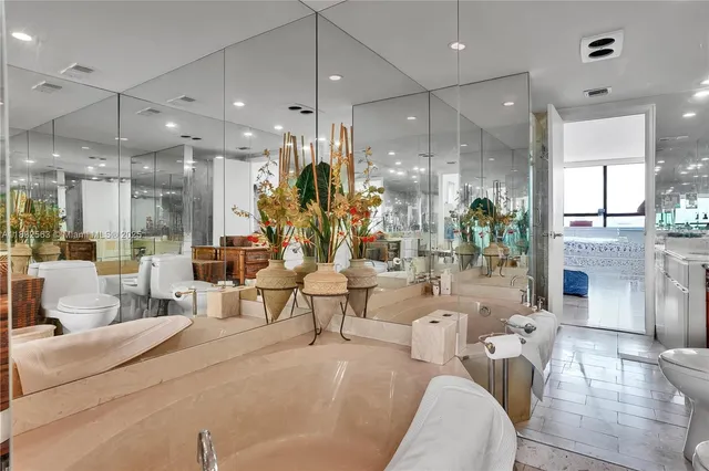 a large living room with stainless steel appliances kitchen island granite countertop furniture