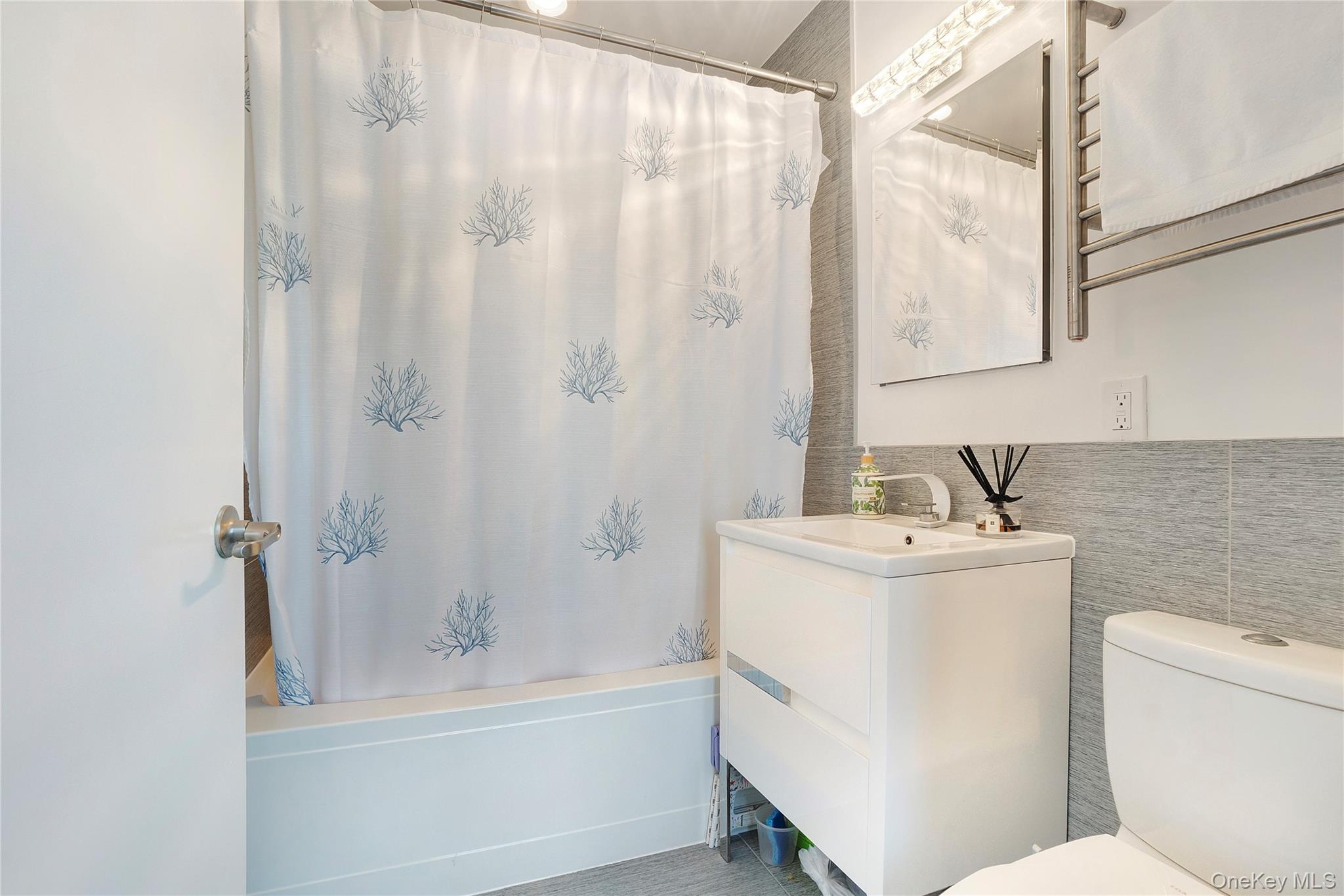 118-20 Ocean Promenade, Unit 5D Queens, NY 11694 - Photo 11 of 17 Bathroom featuring shower / bath combo and vanity