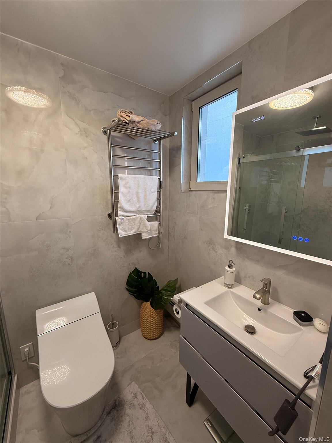 118-20 Ocean Promenade, Unit 5D Queens, NY 11694 - Photo 14 of 17 Bathroom with vanity and a shower stall