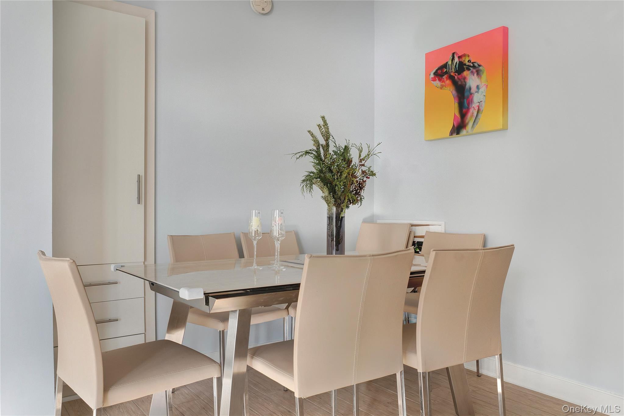 118-20 Ocean Promenade, Unit 5D Queens, NY 11694 - Photo 4 of 17 Dining space featuring baseboards and wood finished floors