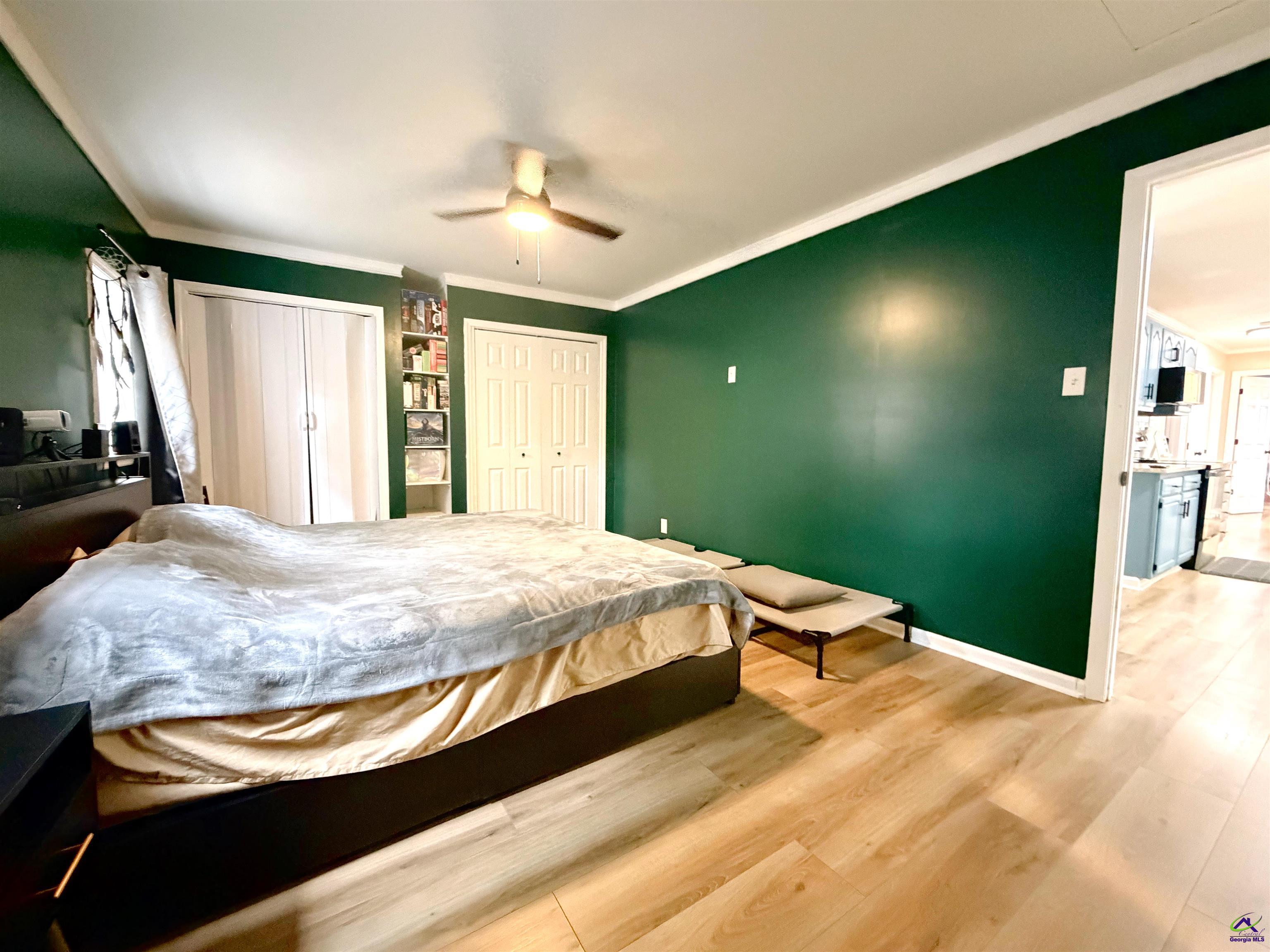 108 Weaver Road Warner Robins, GA 31093 - Photo 11 of 26 a bedroom with a bed and a flat tv screen