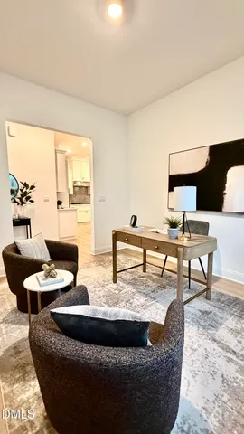 a kitchen with stainless steel appliances kitchen island granite countertop a table chairs and a sink