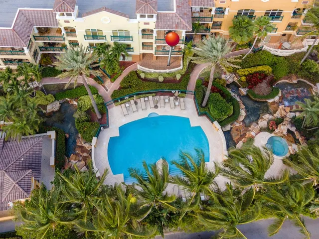 an aerial view of residential house with outdoor space and swimming pool