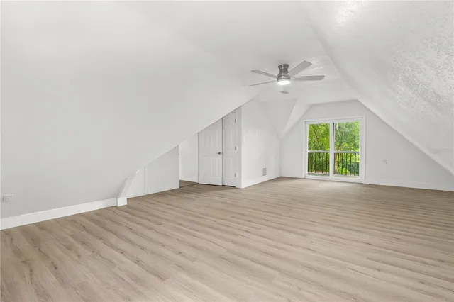 an empty room with wooden floor