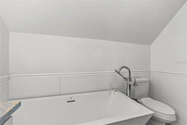a bathroom with a sink and a window