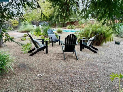 a view of a bench in a backyard