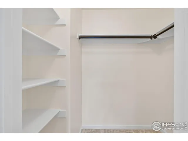 a view of an empty walk in closet